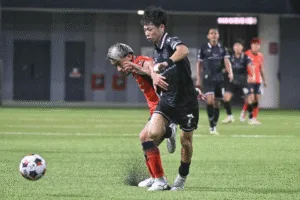 Geylang International's Riku Fukashiro (right) tussling with Hougang United's Yuta Kikuchi, who was later sent off for a headbutt on Fukashiro.
